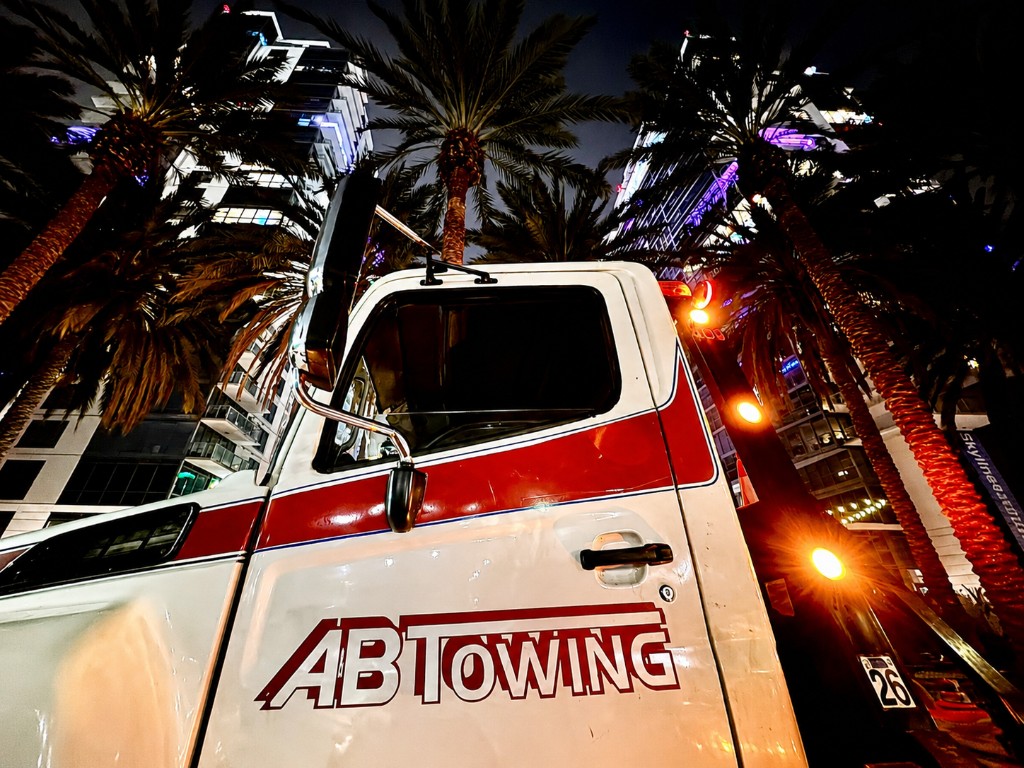 A&B Towing local fleet truck with AB Towing branding at night